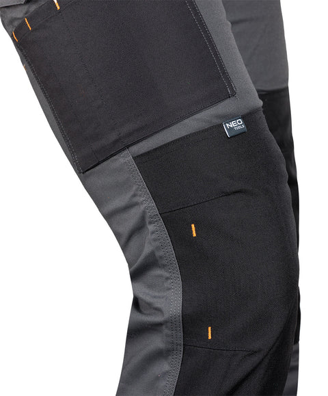 Munkásnadrág Mix&Match Canvas, 280g/m2, 64% poliészter, 34% pamut, 2% elasztán, külső zsebekkel, Cordura megerősítéssel, névtábla tartóval, fényvisszaverő betétekkel, szürke-fekete, több méretben