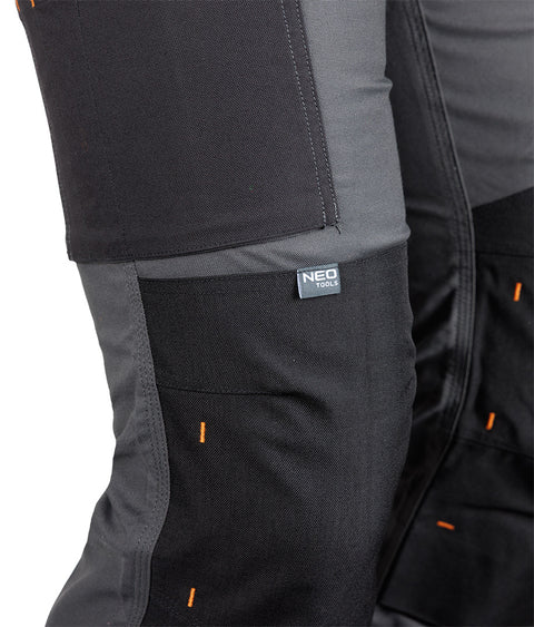Munkásnadrág Mix&Match Canvas, 280g/m2, 64% poliészter, 34% pamut, 2% elasztán, külső zsebekkel, Cordura megerősítéssel, névtábla tartóval, fényvisszaverő betétekkel, szürke-fekete, több méretben